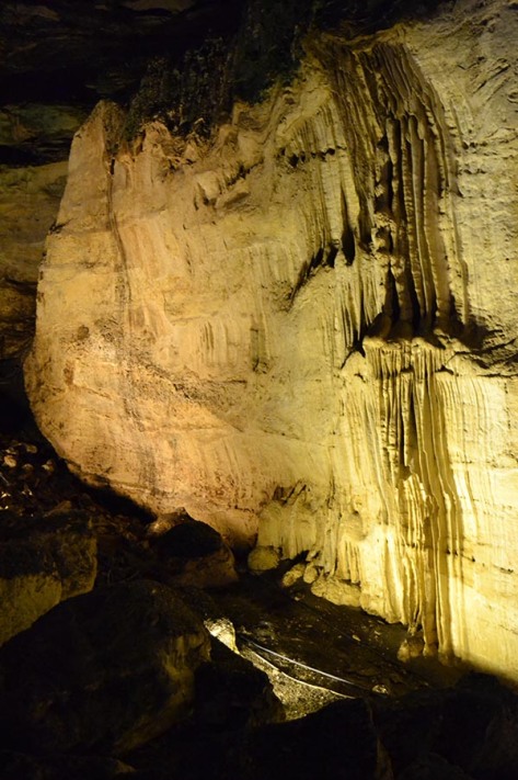 Water erodes the earth within and without the caves. This type of erosion is one of the many reasons the caverns exist. 